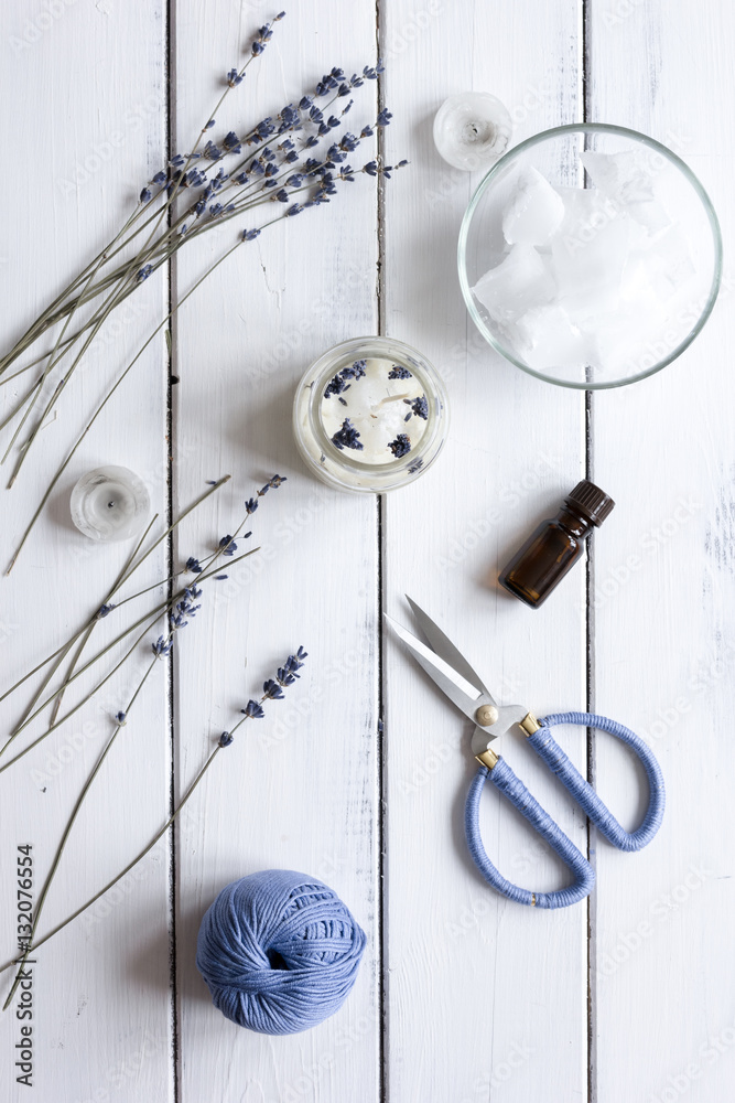 handmade candles with lavender on wooden background top view