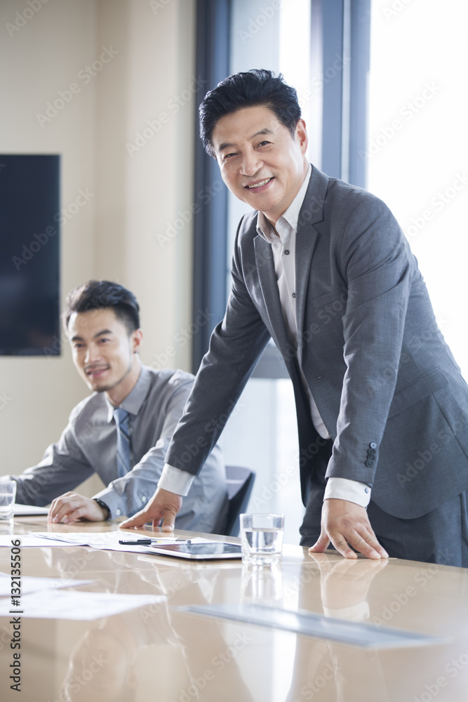 Confident businessmen in meeting room