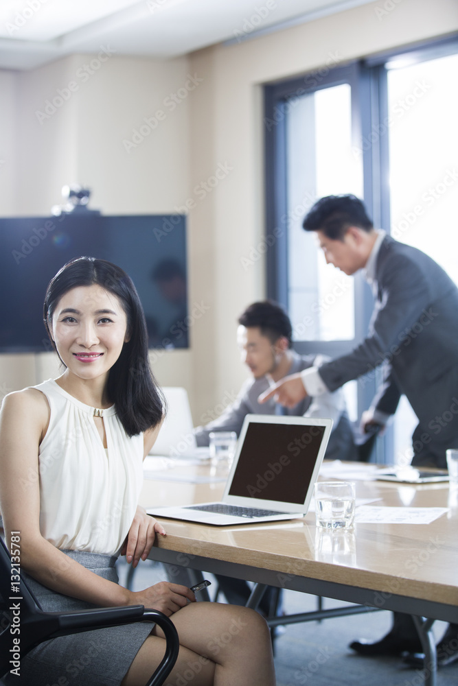 Confident businesswoman in meeting room