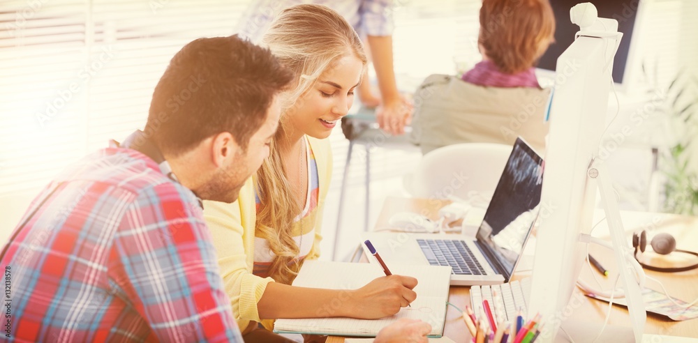 Cheerful designers working on a document