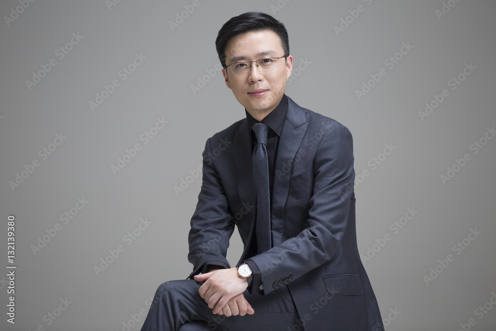 Portrait of mid adult businessman