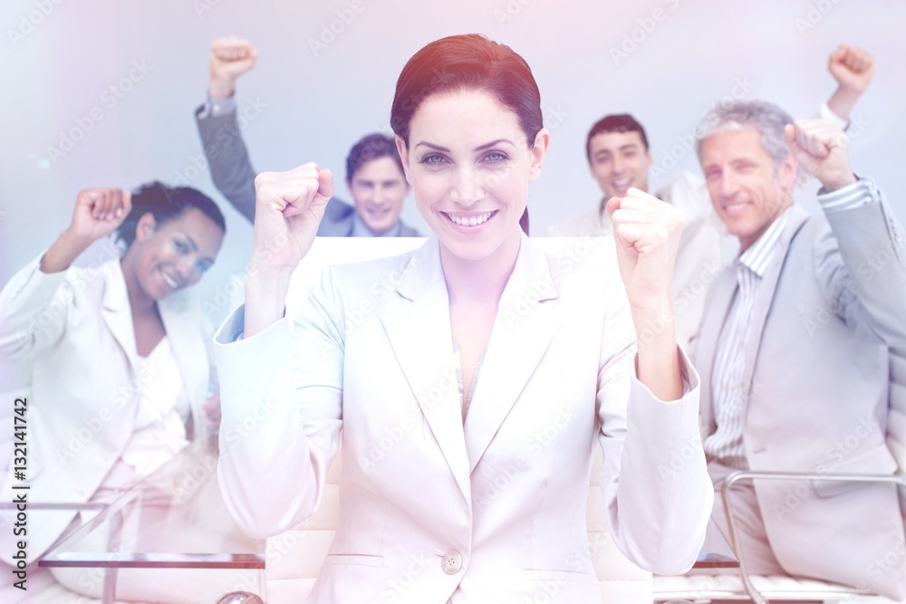 Happy business people celebrating a sucess with hands up