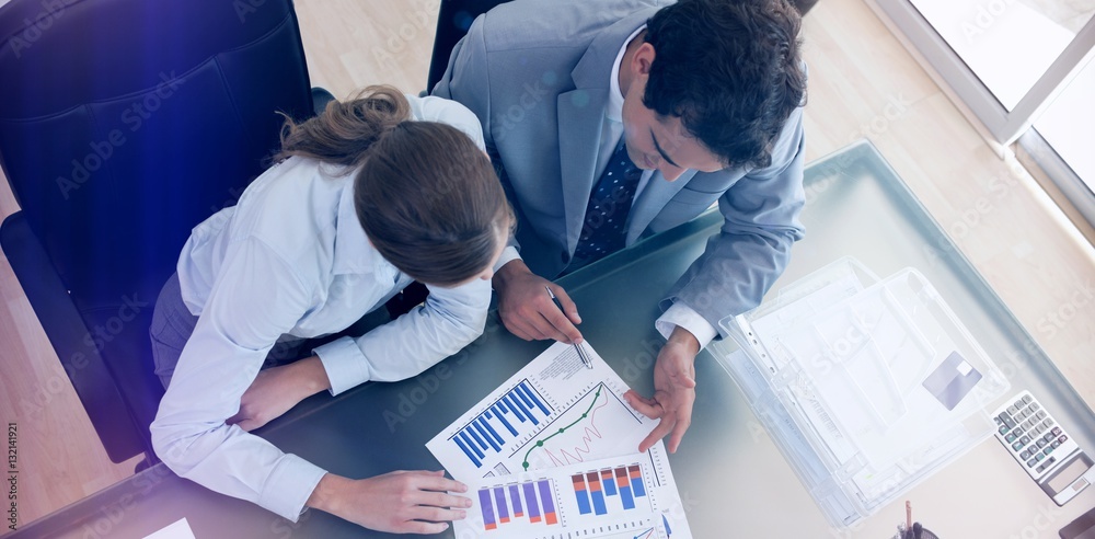 Above view of consultant analyzing data with her client