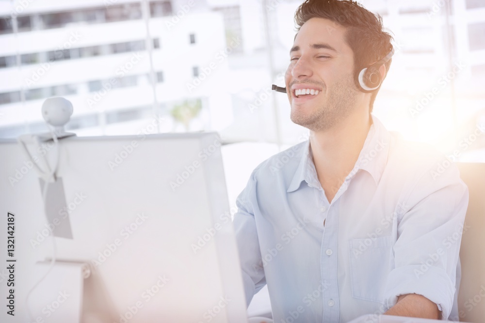 Happy designer laughing during an online communication