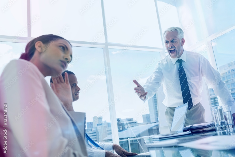 Furious boss yelling at colleagues