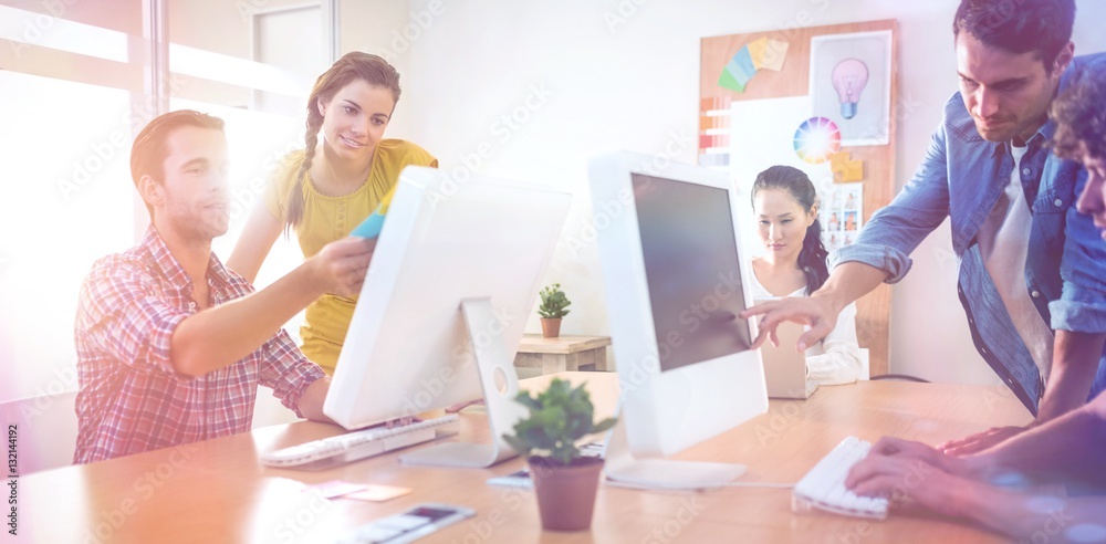 Attentive business team working on laptops