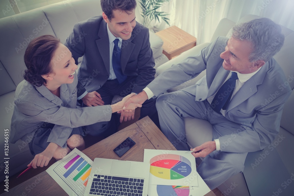 Business people shaking hands while working 