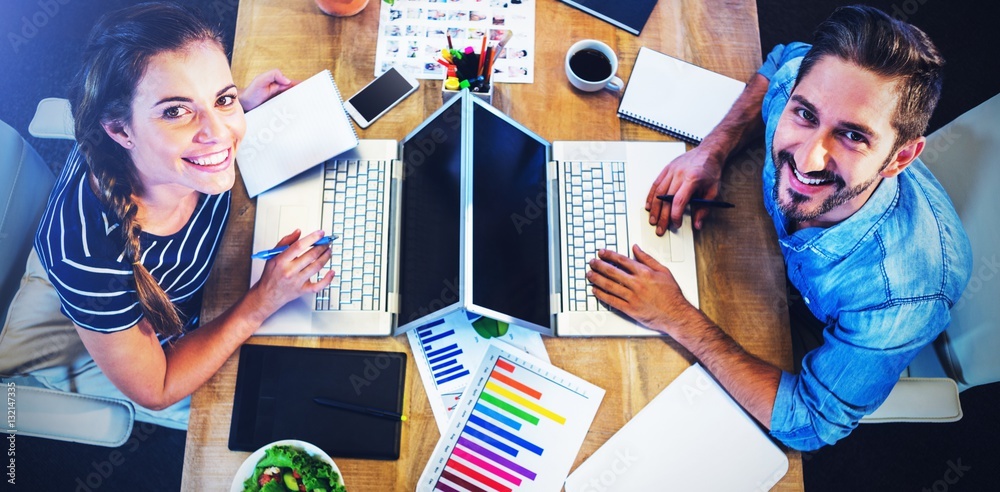 High angle portrait of business people working at the desk