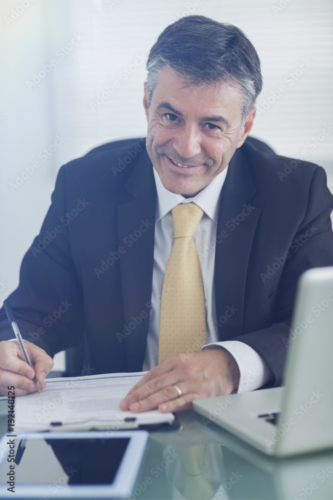 Business man smiling while working