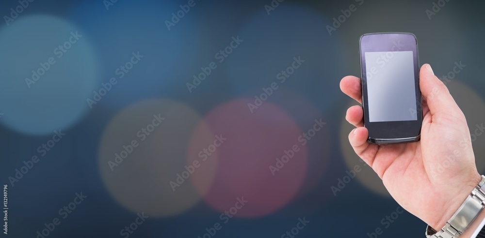 Composite image of hand of a businessman holding mobile phone 3d