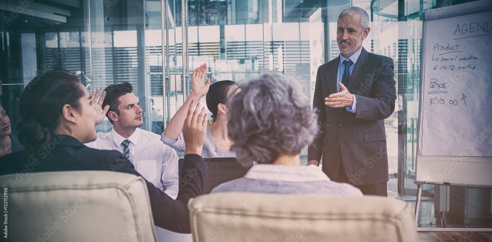 Businessman interacting with coworkers