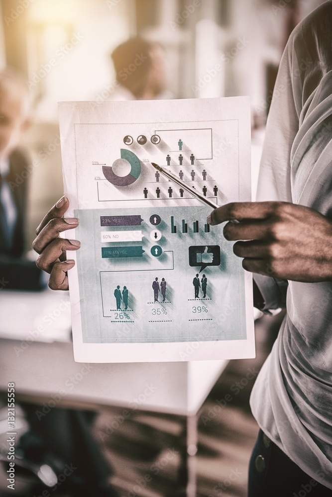 Midsection of businesswoman holding graph