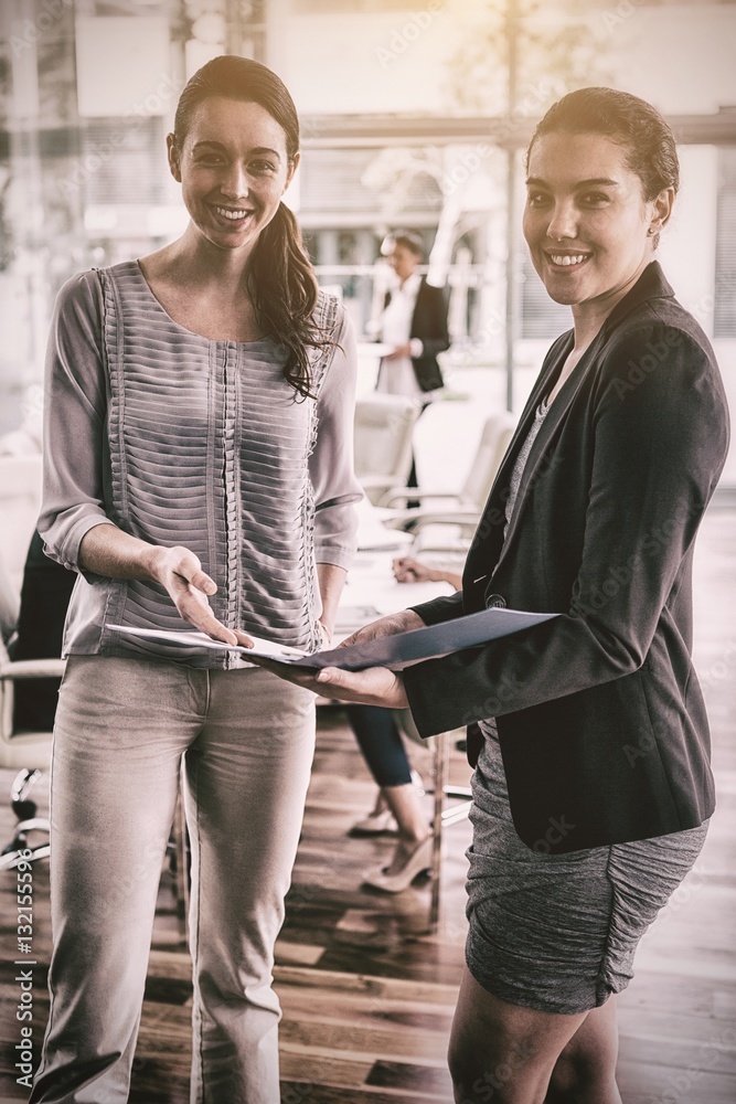 Businesswomen holding file