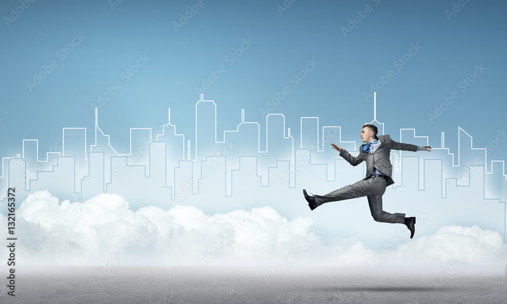 Businessman jumping high