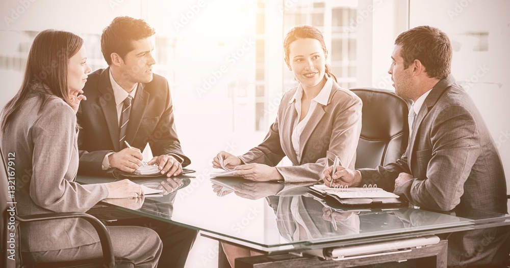 Businessmen and businesswomen talking during a meeting