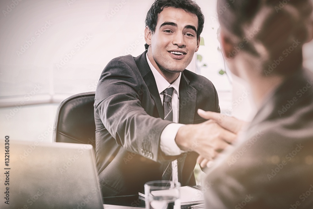 Smiling manager interviewing a female applicant