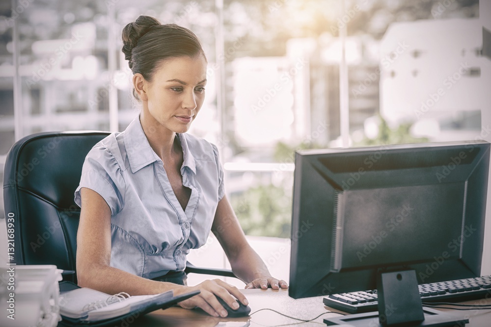 Businesswoman working on her computer