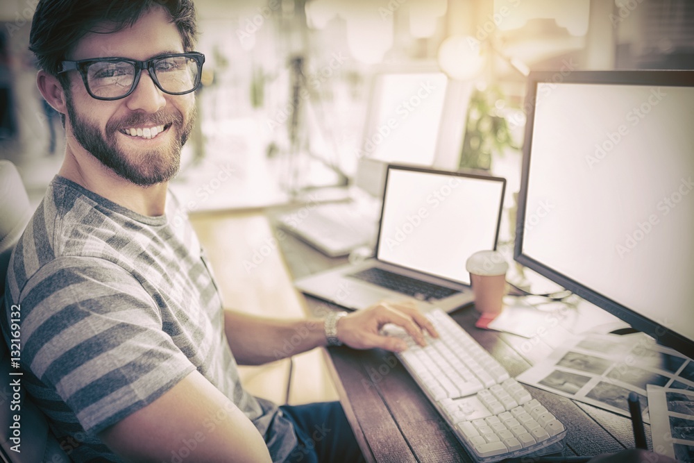 Casual businessman using computer in office