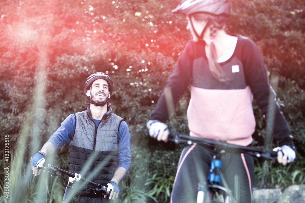 Biker couple cycling in countryside