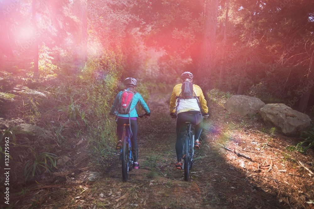 Biker couple cycling in countryside