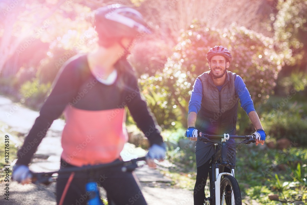 Biker couple cycling in countryside