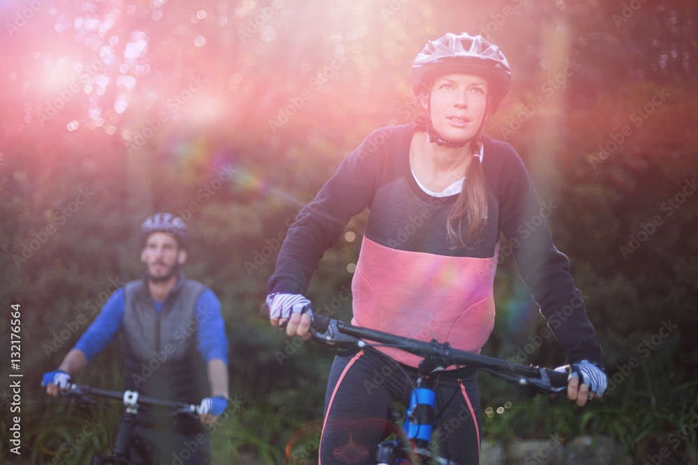 Biker couple cycling in countryside