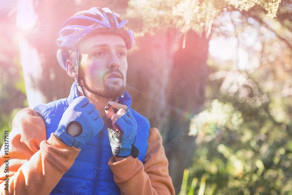 Male mountain biker wearing bicycle helmet