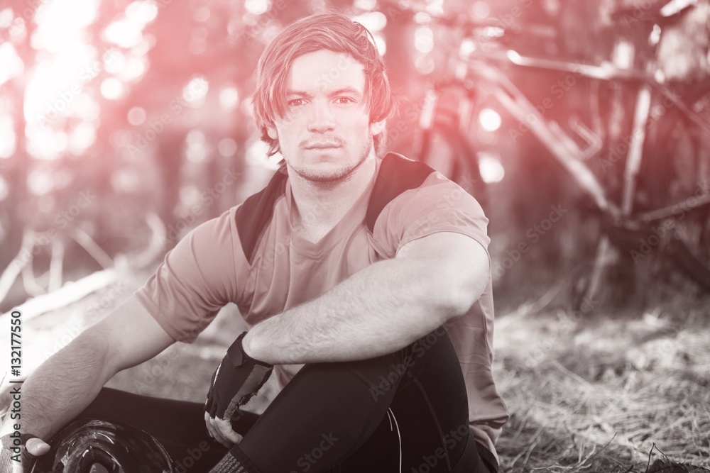 Portrait of male mountain biker in forest