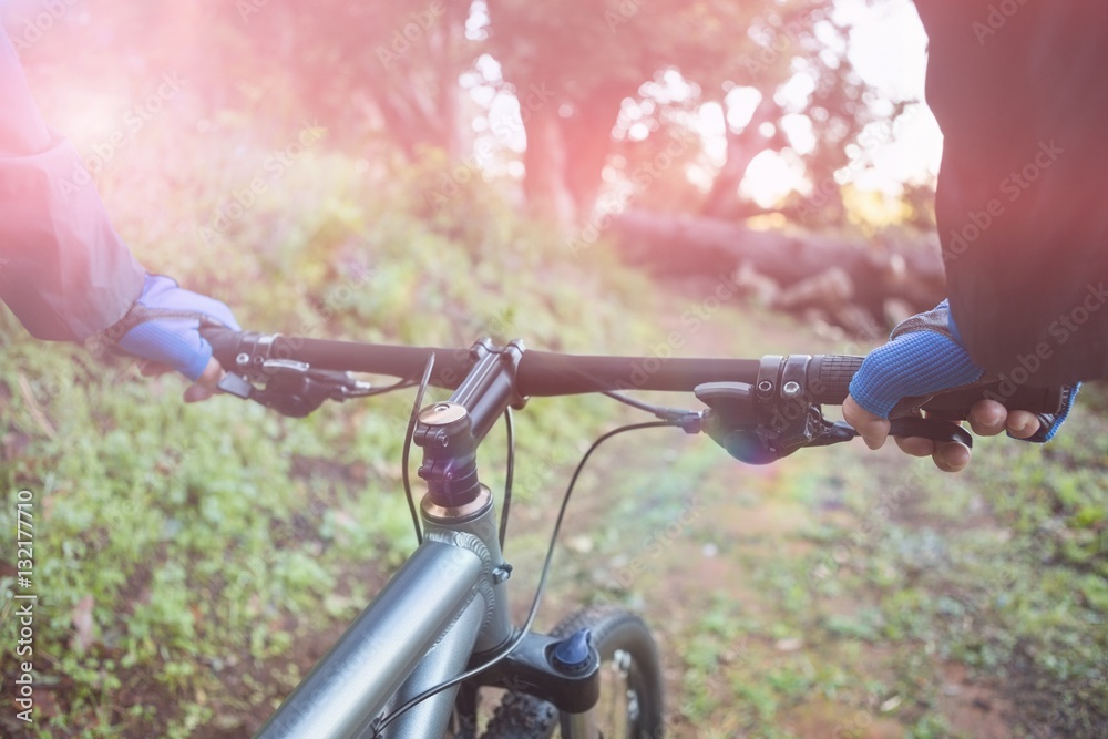 Close-up of male mountain biker riding bicycle