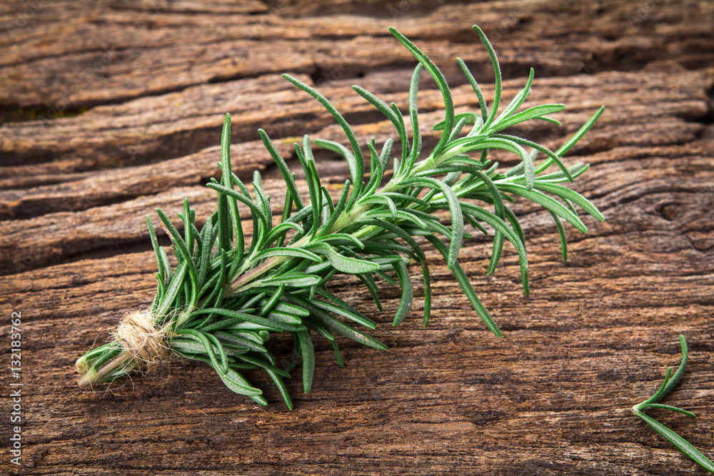 Fresh green Rosemary bound on a wooden board