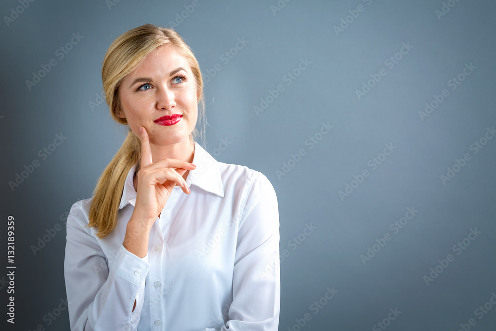 Young woman in a thoughtful pose