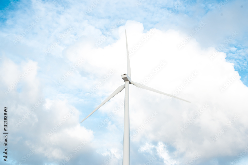 Wind turbines. Ecology wind against cloudy sky background with c