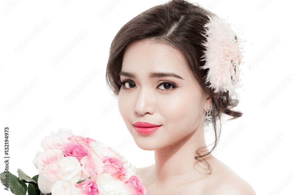 Happy bride with a bouquet of roses. Isolated on white backgroun