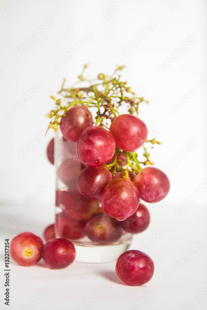 Red grape on glass