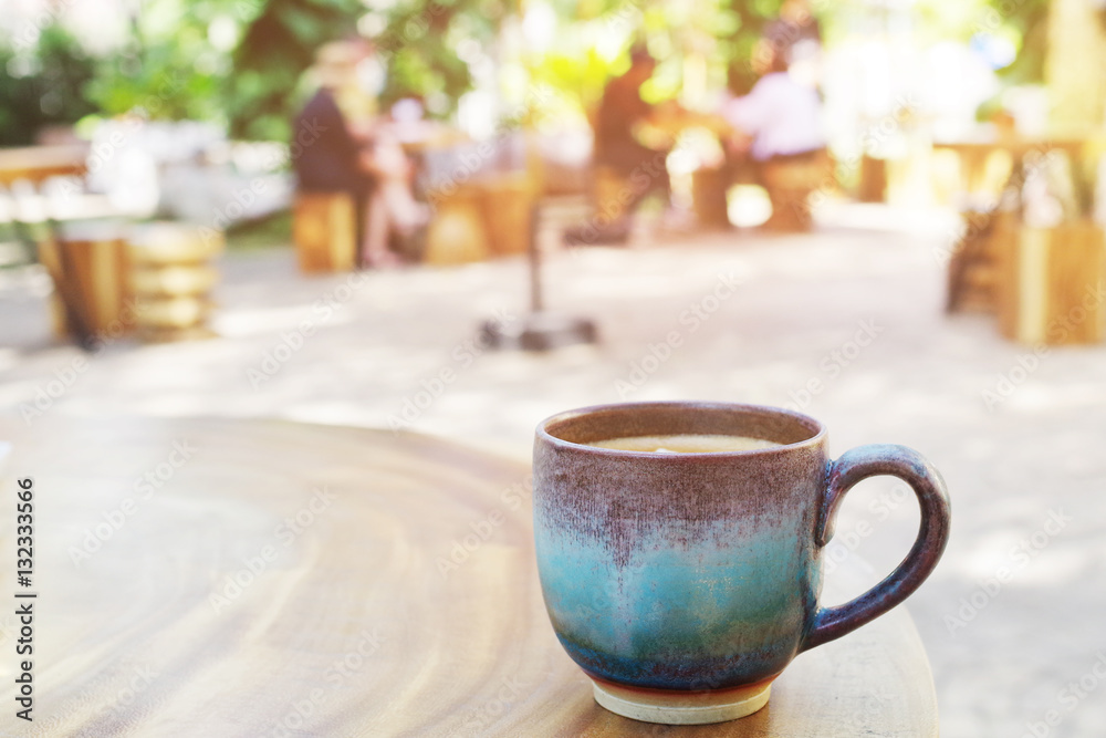 Vintage cup of coffee or cocoa on wood table in outdoor coffee s