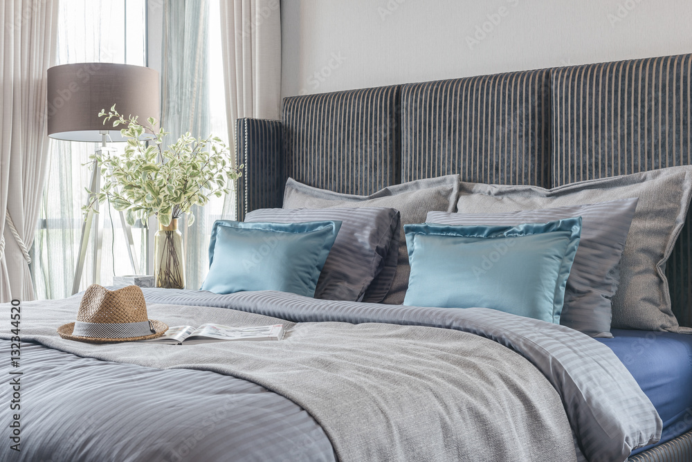 modern bedroom with black color bed tone and set of pillows