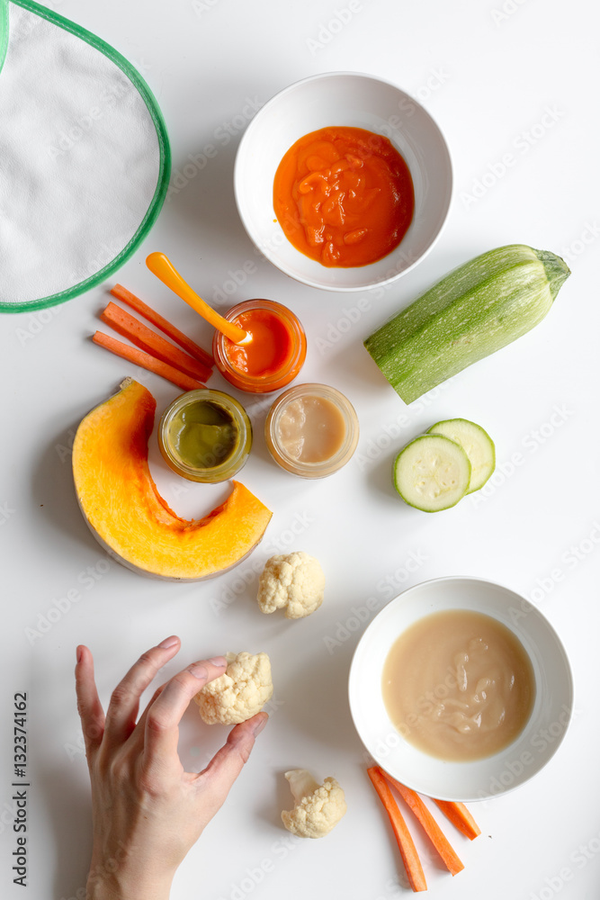 cooking vegetable puree for baby on white background top view