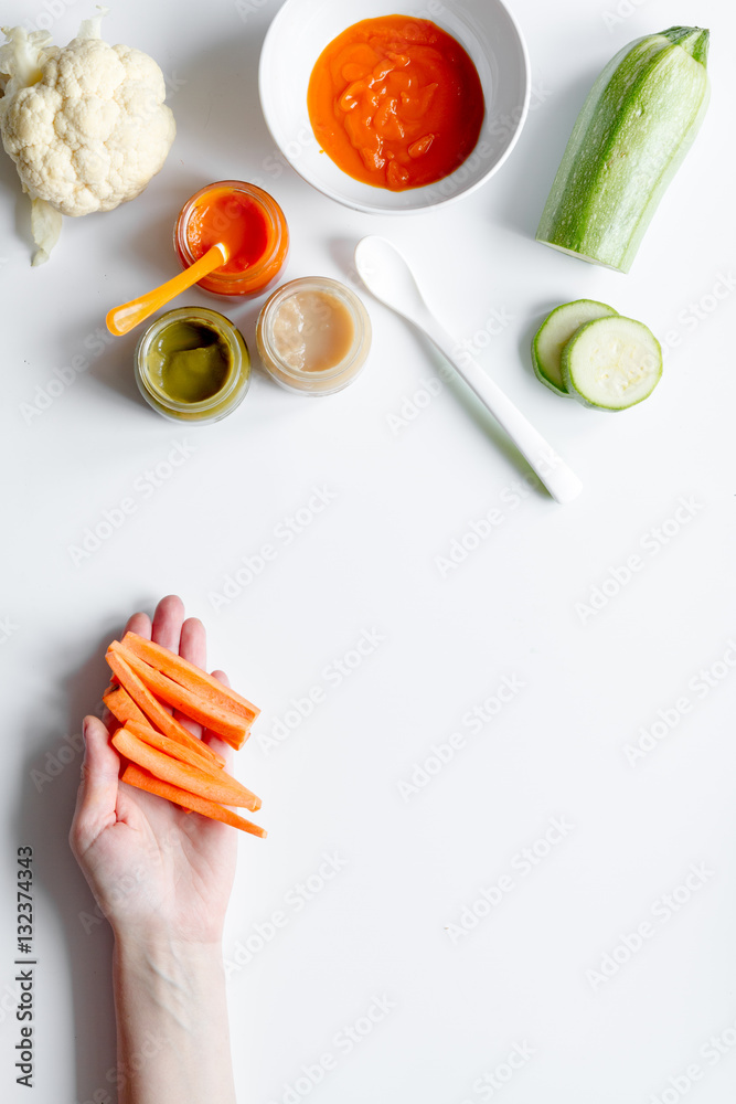 cooking vegetable puree for baby on white background top view