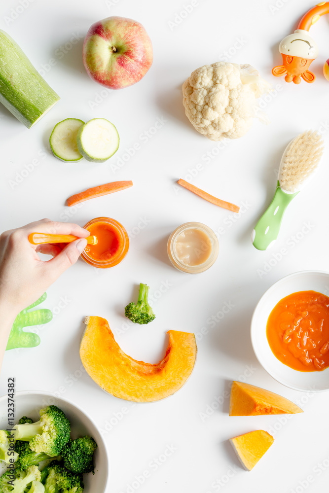 cooking vegetable puree for baby on white background top view