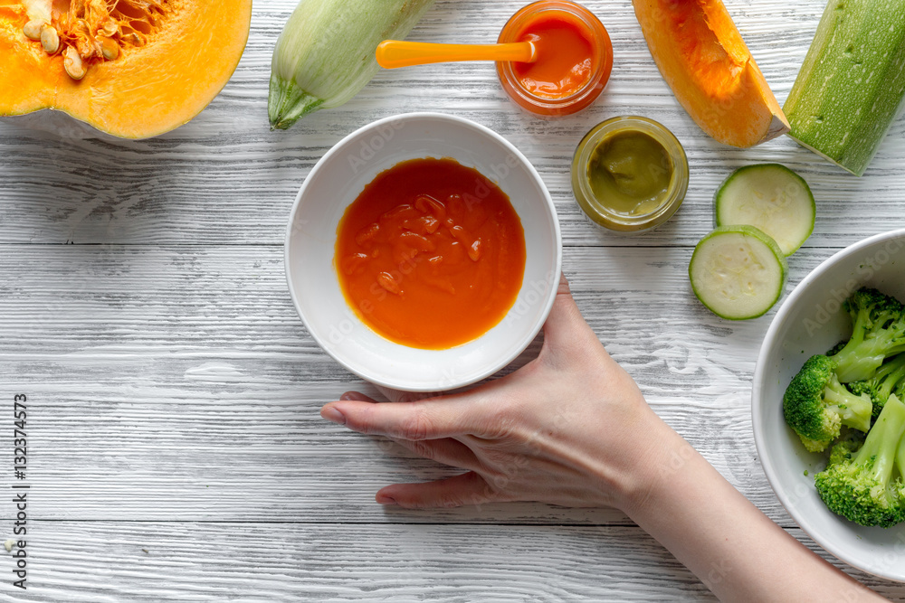 baby vegetable puree on wooden background top view