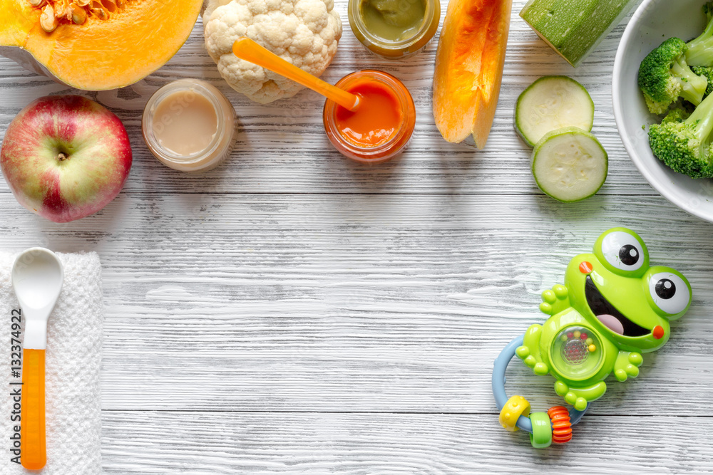 baby vegetable puree on wooden background top view