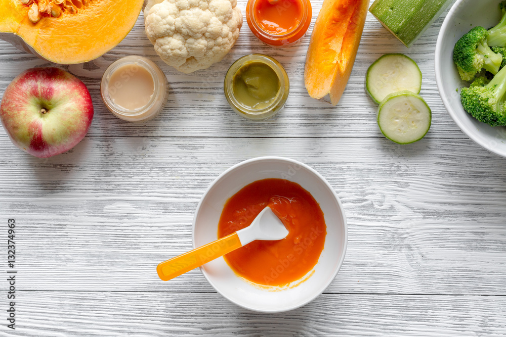 baby vegetable puree on wooden background top view