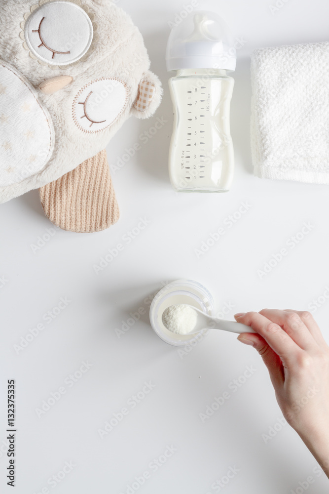 preparation of mixture baby feeding on white background top view