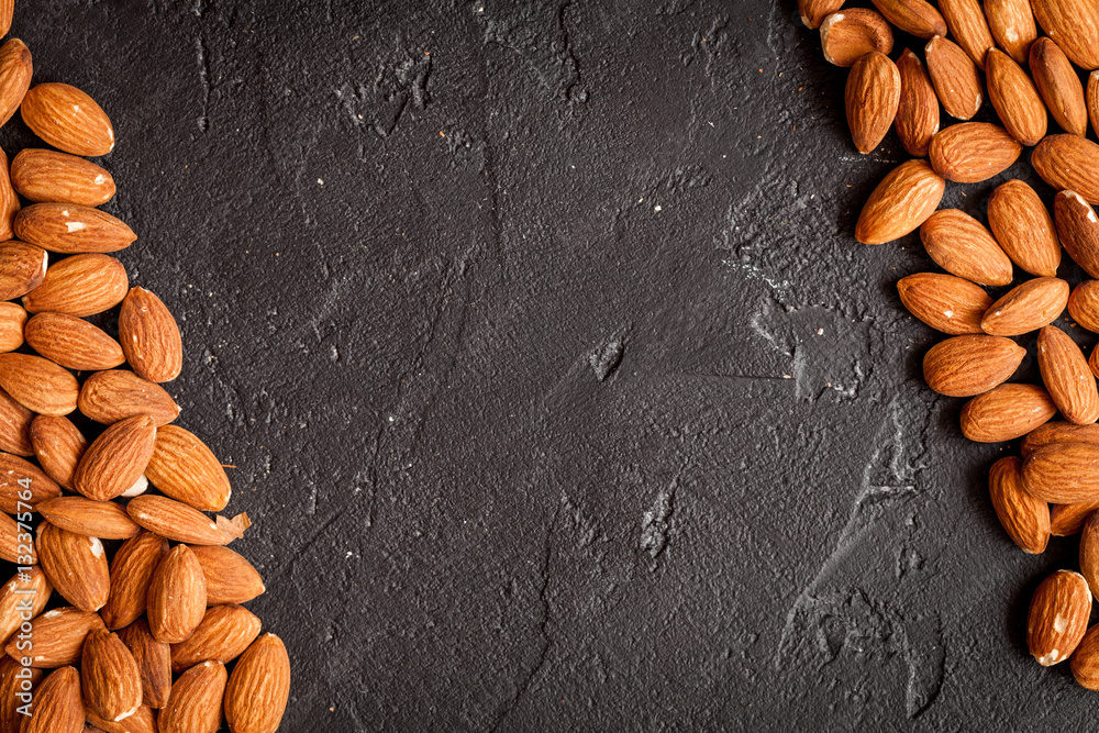 almonds on dark background top view