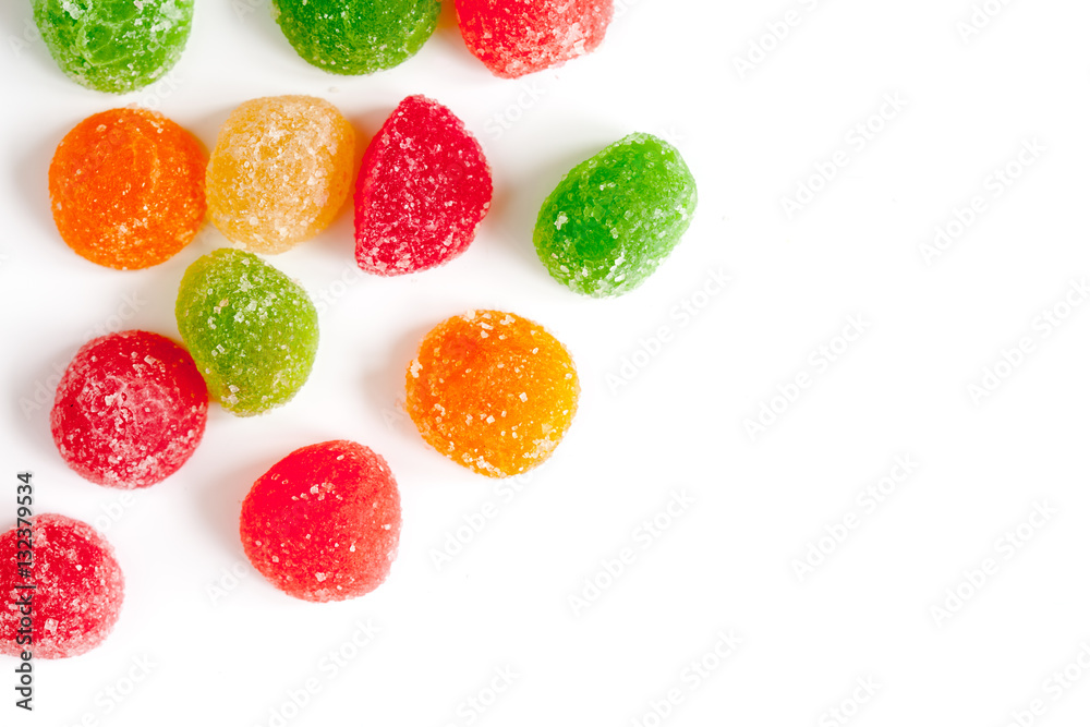 sweets and sugar candies on white background top view