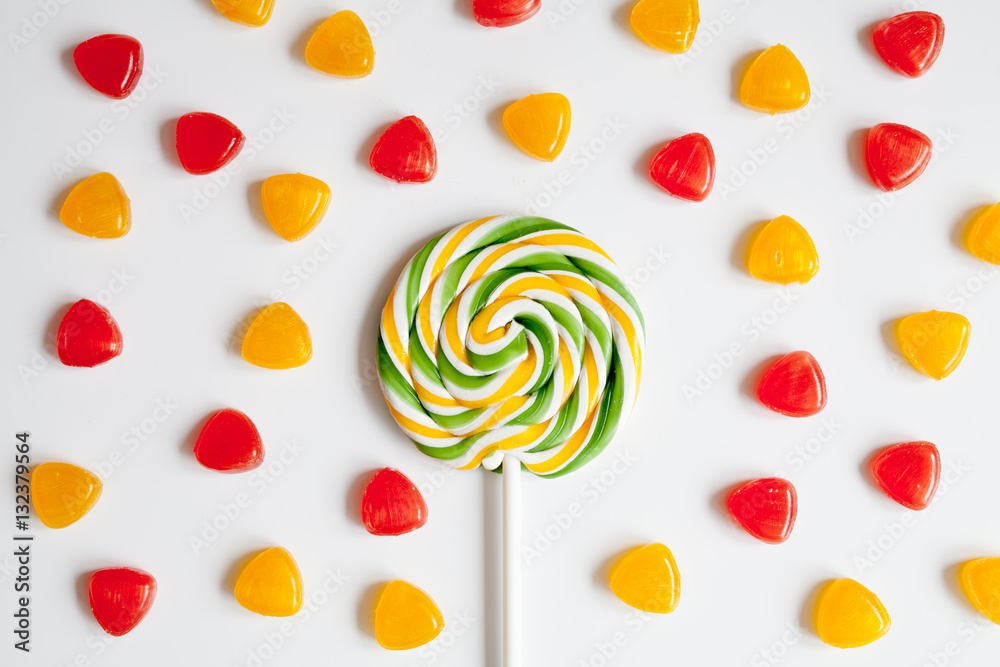 sweets and sugar candies on white background top view