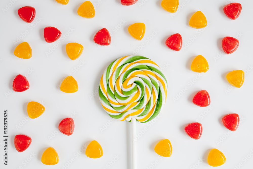 sweets and sugar candies on white background top view