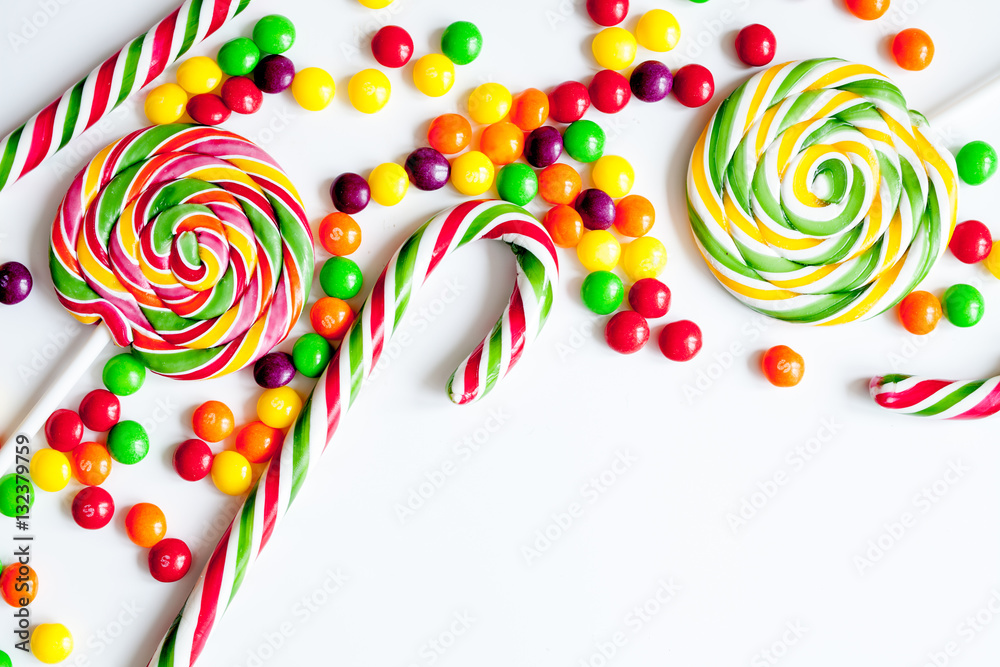 sweets and sugar candies on white background top view