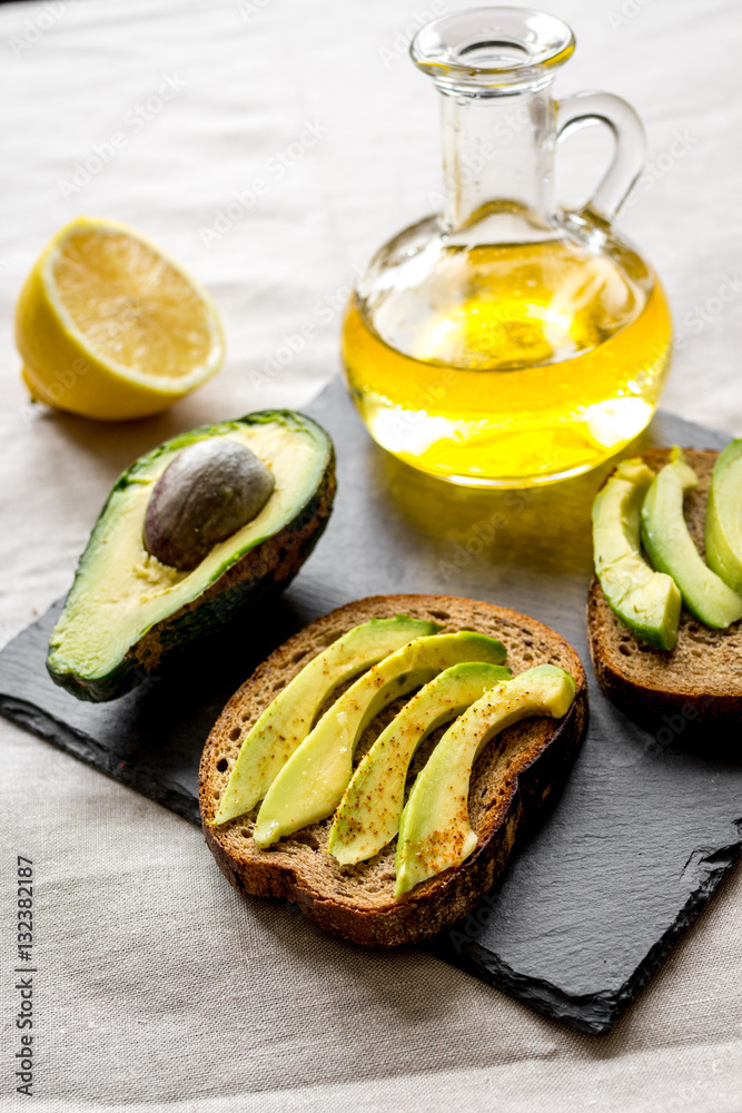 making sandwiches with avocado healthy organic food top view