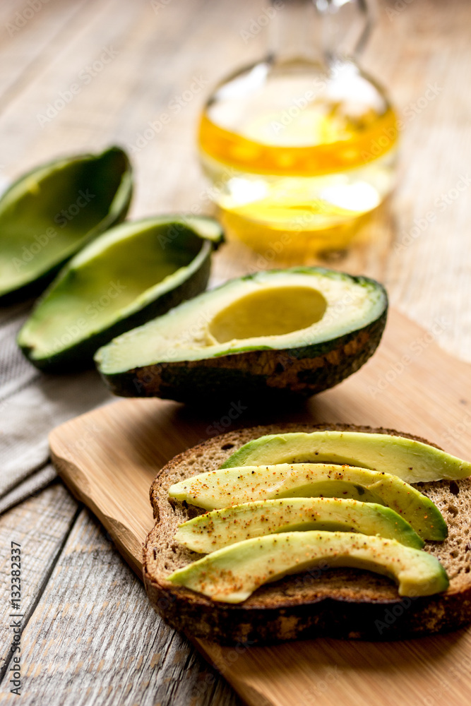 making sandwiches with avocado healthy organic food top view